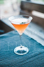 peach martini in glass